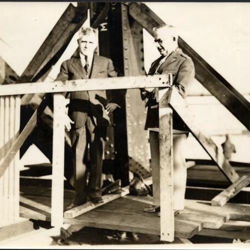 [Joseph Strauss (left) and Major Thomas L. McKenna, Catholic Chaplin of Fort Scott on Golden Gate Bridge during construction]