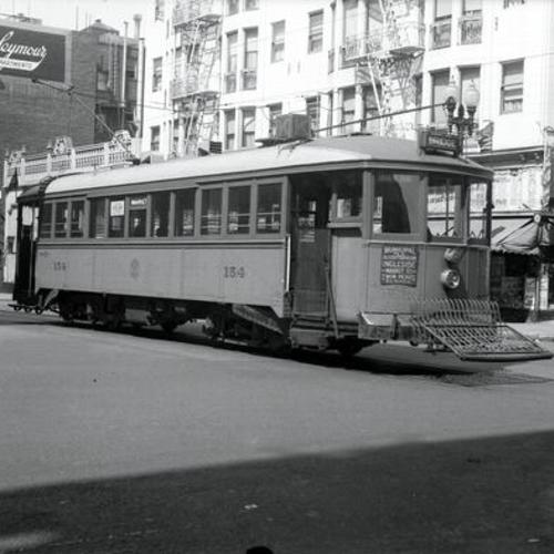 [Geary and Leavenworth streets looking northwest at inbound "K" line car 154 re-routed over Geary street during parade]