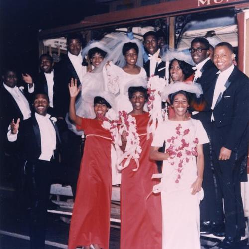 [Group of family and friends celebrating a wedding and ride on cable car on California Street in 1966]