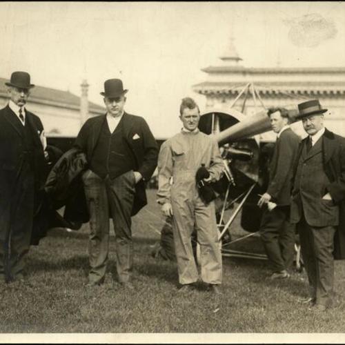 [Lincoln Beachey, Silvio Pettirossi and Art Smith standing in front of an airplane at the Panama-Pacific International Exposition]