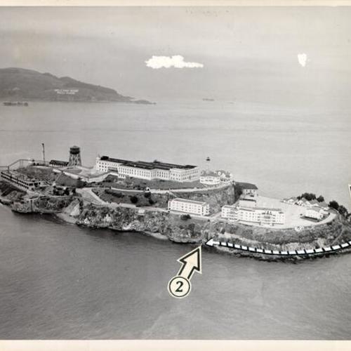 [Aerial view of Alcatraz Island with arrows showing where two convicts made an escape attempt on September 29, 1958]