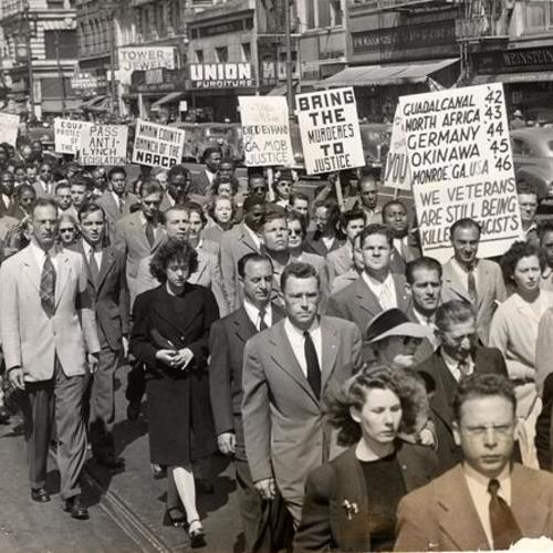 [March down Market street protesting lynching in Georgia]