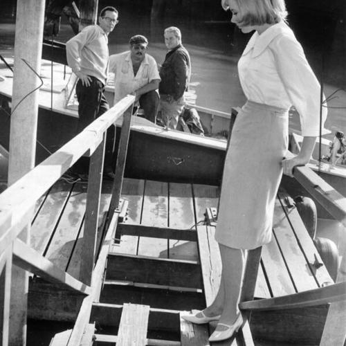 Carla Loyd stepping carefully on launching ramp boards