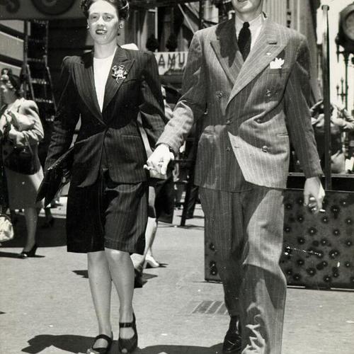 [Mr. and Mrs. Ray Bannister strolling along Market Street]