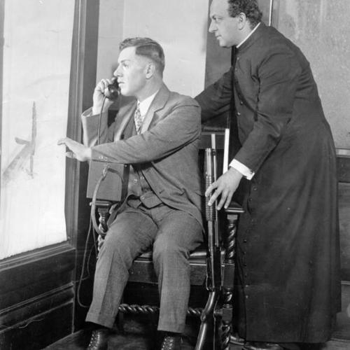 [Two unidentified men reenacting events of bombing at Saints Peter and Paul's Church]