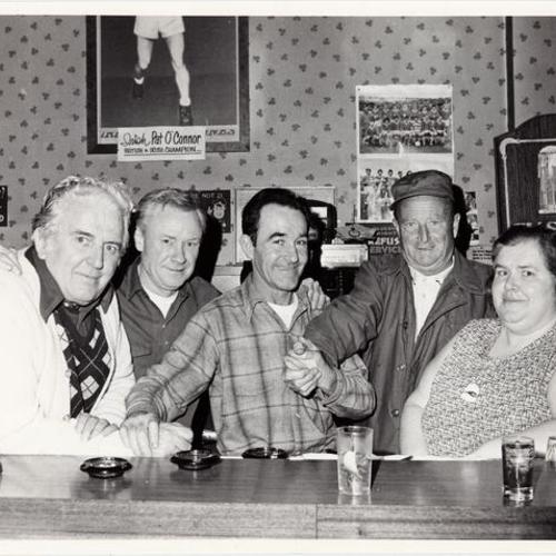 [Unidentified group of people at Hennessy's Irish bar]