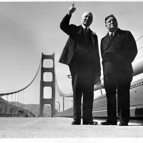 [Angelo J. Rossi, mayor of San Francisco, pointing out features of Golden Gate Bridge to Fiorello H. LaGuardia, mayor of New York]