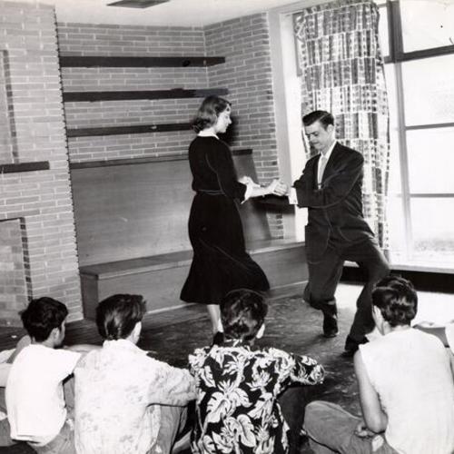 [Arthur Murray dance instructors teaching a class of boys at the Youth Guidance Center]