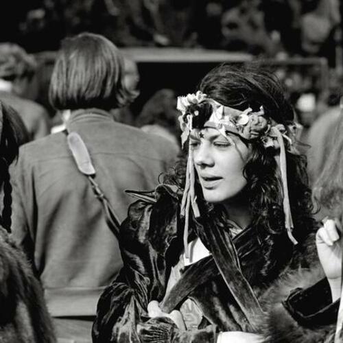 [Woman in hippie dress at a summer music festival]