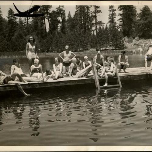 [People swimming in Birch Lake at Camp Mather]