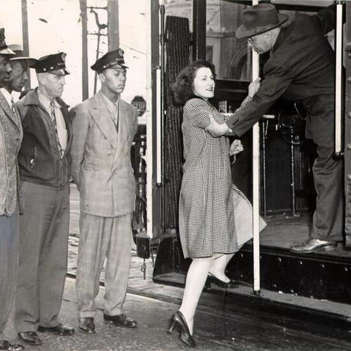 [Special Instructor Thomas M. Miller with a group of new streetcar conductors at the Geneva Avenue carbarn]