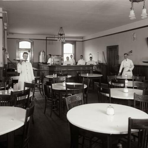 Sacred Heart College cafeteria with servers