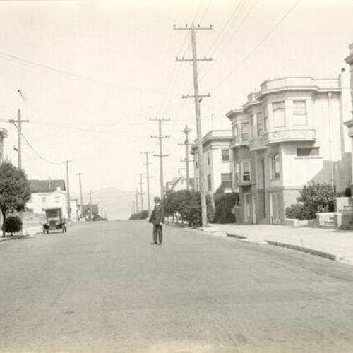 [Man standing on 25th Avenue between California and Lake]