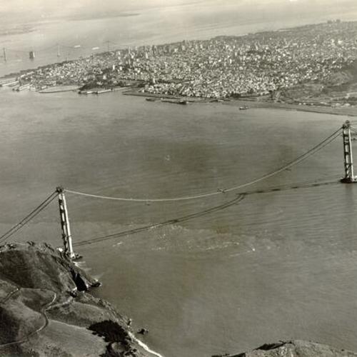 [Aerial view of the Golden Gate Bridge under construction]
