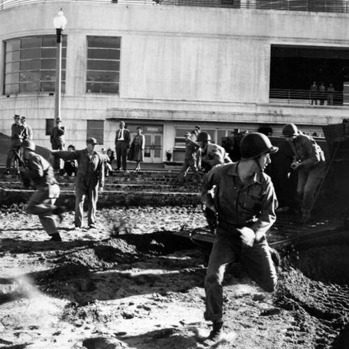 [Members of a San Francisco Marine Reserve infantry battalion rehearse on the Aquatic Park beach]