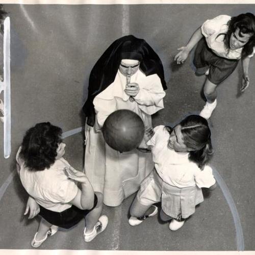 [Sister Mary of Passion supervising a basketball game at the Home of the Good Shepherd]