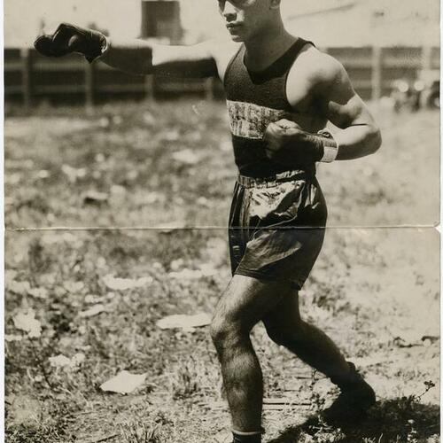 Filipino boxer Pancho Villa poses outdoors