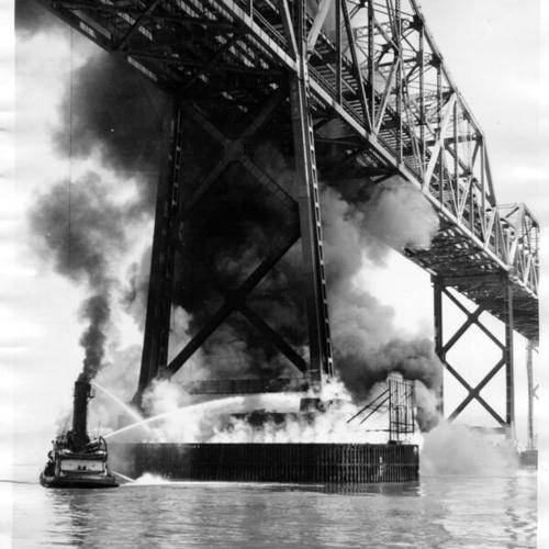 [Fireboat fighting a fire on a pier of the San Francisco-Oakland Bay Bridge]