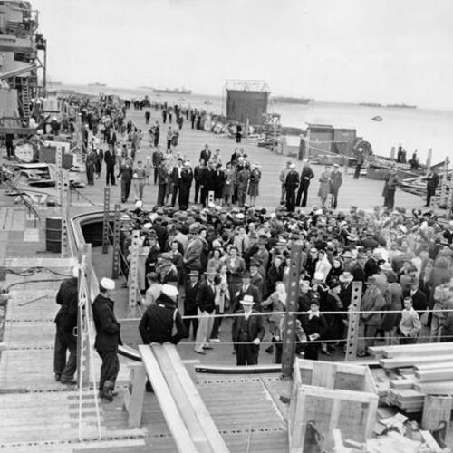 [Civilians visiting the U. S. S. Hornet in drydock at Hunters Point Naval Shipyard]