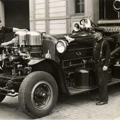 [Firemen cleaning fire engine at Old Engine 10 on 17th and Folsom Street]
