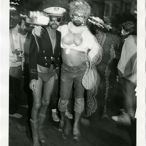 [Two men in costume posing on Castro street]
