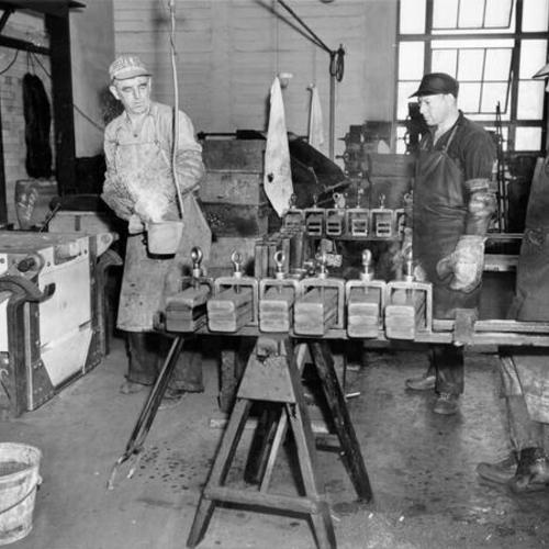 [Employees George Dorn, Sam Kaster and Frank Cruz working at the U. S. Mint in San Francisco]