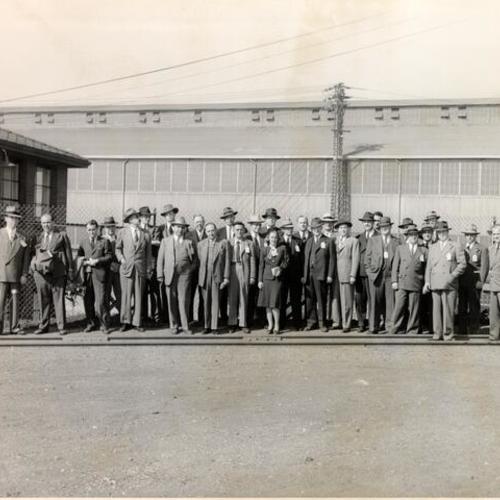 [Press on tour of the Bethlehem Steel Company posing for a photo]
