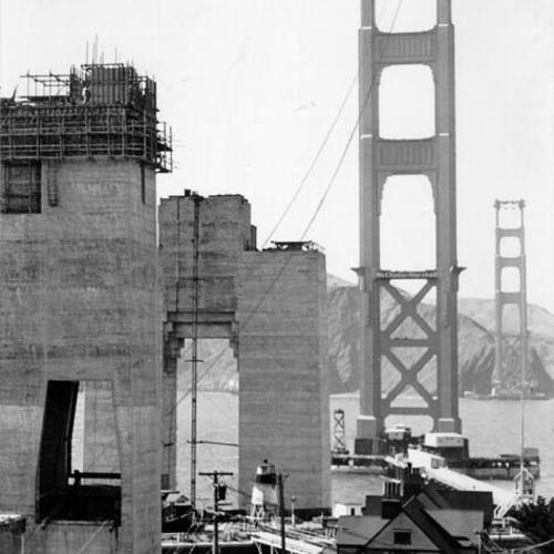 [Golden Gate Bridge south and north towers near completion as seen from Fort Point]