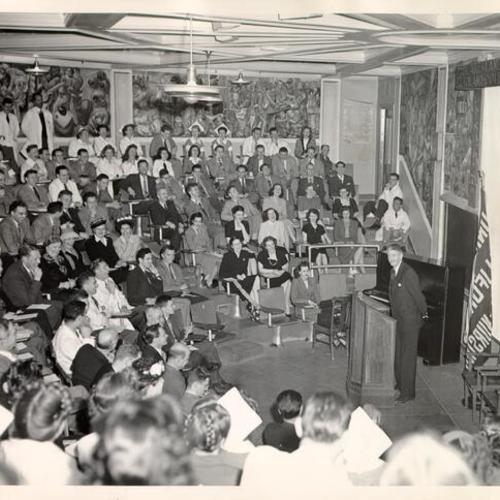 [Dr. Stafford Warren, M. A. M. D., speaking before an audience in Leland Hall at U. C. Medical Center]