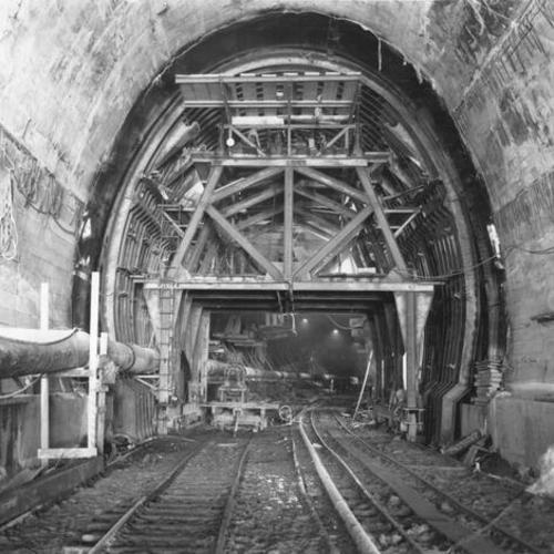 [View of metal lining and frames located inside of Yerba Buena Island tunnel during San Francisco-Oakland Bay Bridge construction]