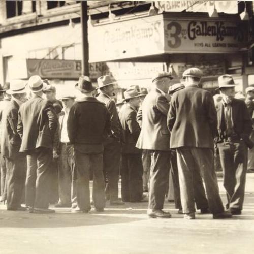 [Men gathering during on waterfront during Longshoremen's Strike]