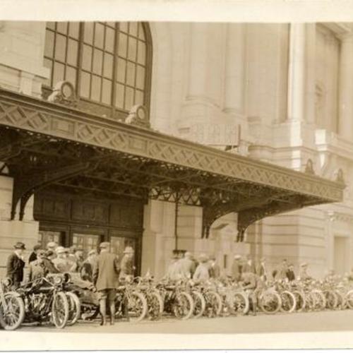 [Members of the San Francisco Motorcycle Club (SFMC) parked in front of Civic Auditorium]