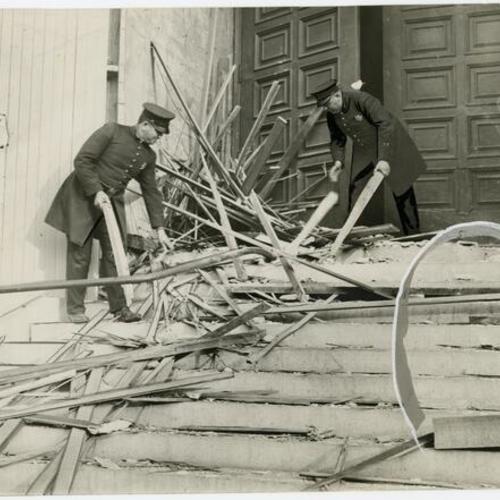 [Police officers investigating the bombing of Saints Peter and Paul's Church]