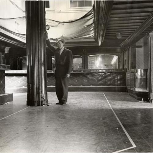 [Barney Gould standing in the main salon of his riverboat "Fort Sutter"]