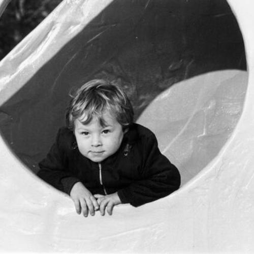 [Lou Robles' grandson plays in the Children's Playground at Golden Gate Park]