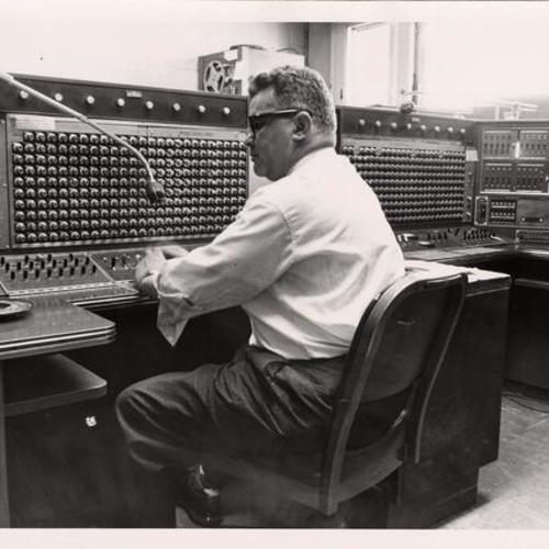 [Employee working at the Communications Room in Old Hall of Justice]