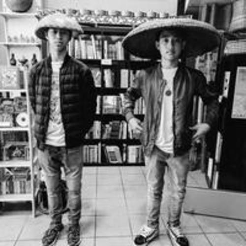 [Two teenagers posing inside the Arkipelago Bookstore wearing traditional Filipino hats]