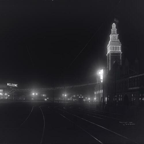 Ferry Building lit up at night during Fleet Week