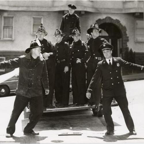 [Group of firemen from Engine 31 leaving firehouse at 1088 Green Street for last time]