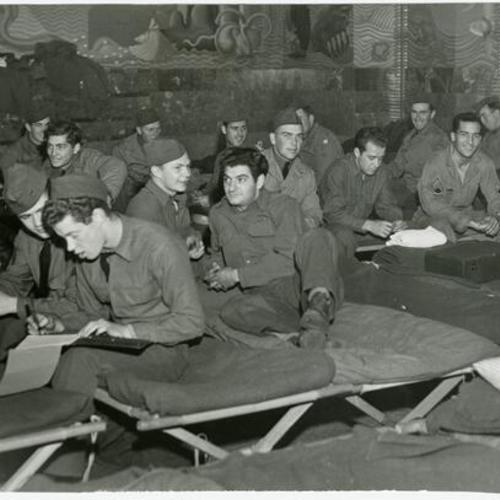[Troops of Battery B, 216th Coast Artillery from Camp Haan take over the highly decorative Aquatic Park casino for a barracks during their tour of duty in the Bay Area]
