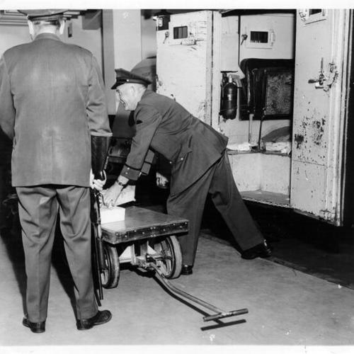 [Two guards loading a truck at the Federal Reserve Bank of San Francisco]