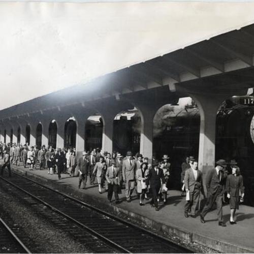 [Commuters on platform at Southern Pacific terminal]