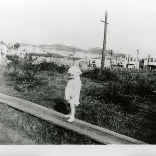 [Betty Lou on boardwalk leading to house on 25th Avenue]