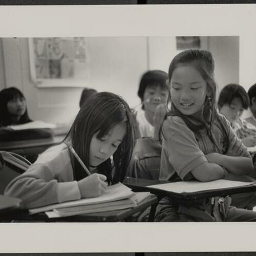 Children sitting in their desks at Vietnamese language school in YMCA