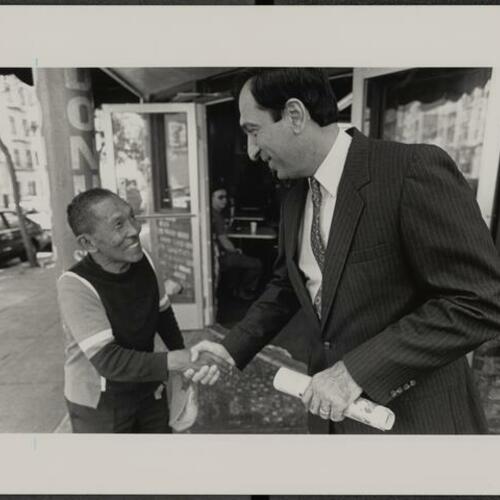 Mayoral candidate Art Agnos campaigning and shaking hands