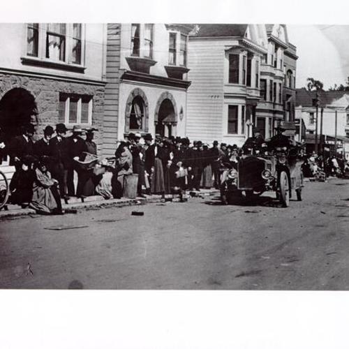 [Refugees standing in a bread line on Clayton Street]