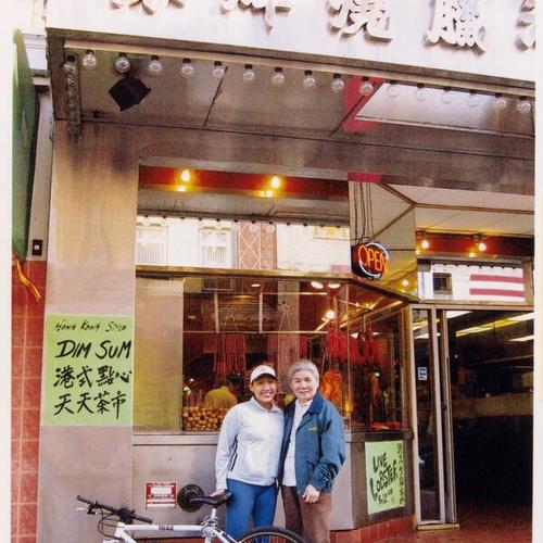 [Margaret with her mother Mei in front of Silver Restaurant in Chinatown on Washington Street]