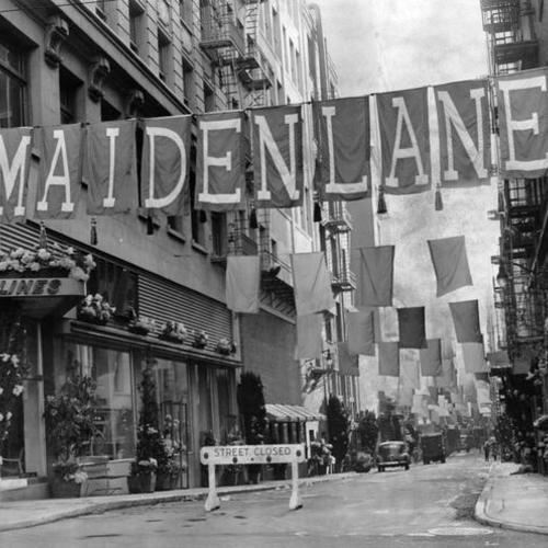 [Maiden Lane at dawn on the first day of the annual Spring Comes to Maiden Lane Festival]
