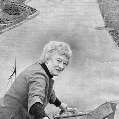 [Mrs. Rickey Wood helping to pave Day Street]