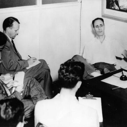 [Harry Bridges holding a press conference at ILWU headquarters in Honolulu]